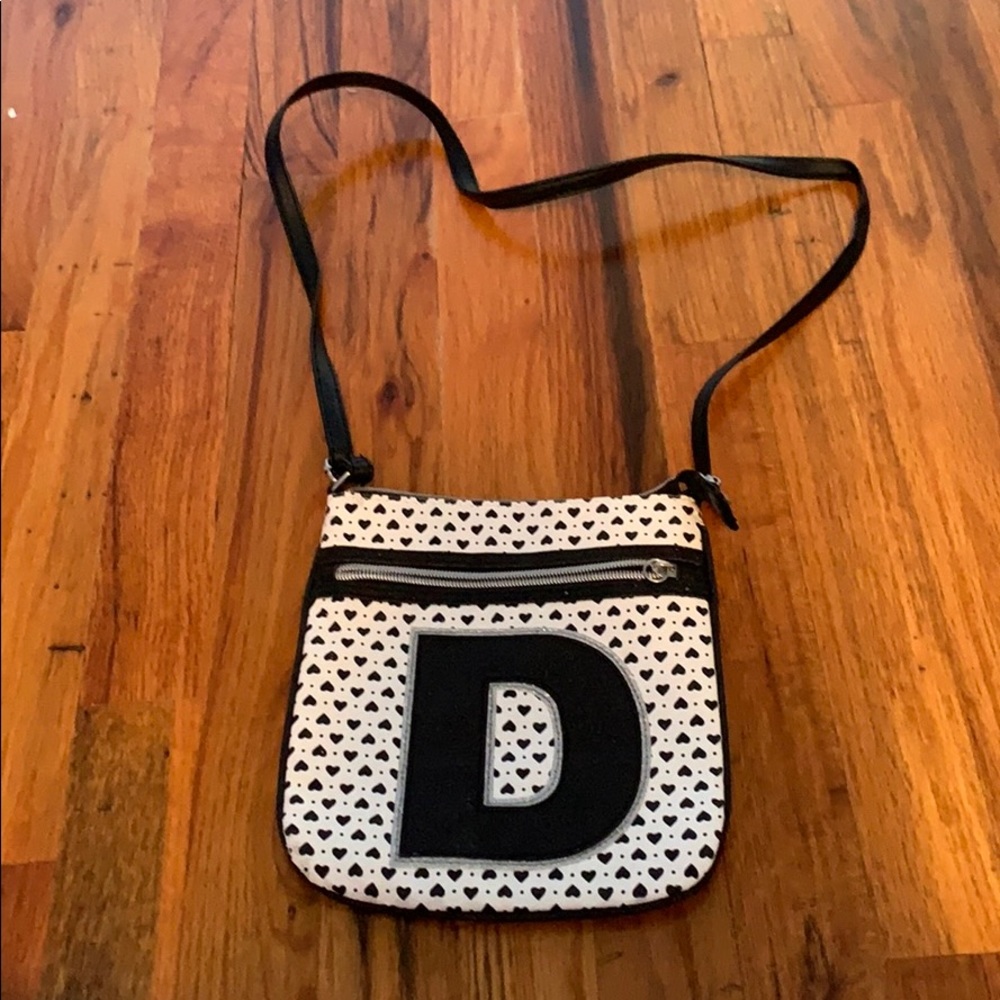 black and white crossbody bag. letter D